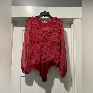 Abercrombie and Fitch bodysuit
Red and white, see through sleeves, V neck
Size M